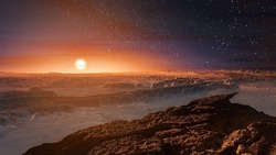 Landscape on planet Mars, scenic desert and rock on the red planet.The sun rises over the horizon.Sunrise.Alien landscape.Elements of this Image Furnished by NASA