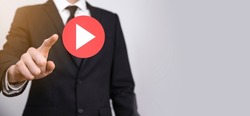 Businessman pressing, hold play button sign to start or initiate projects.Video Play Presentation. Idea for business, technology.media player button. Play icon.Go