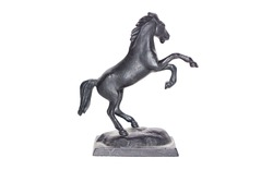 Metal statuette of horse. Horse stays on back legs.