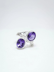 Natural amethyst gemstone silver ring on white background