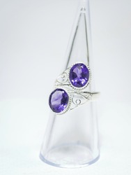 Natural amethyst gemstone silver ring on white background