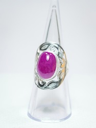 Natural ruby gemstone silver ring on white background