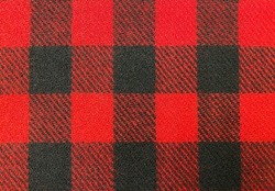 Natural wool fabric. Plaid fabric pattern background textured. Close-up red fabric texture. Woolly plaid fabric.