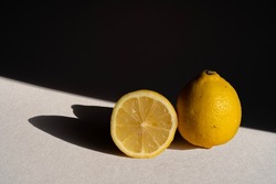 Gennevilliers, France - 11 03 2021: still life. Studio shot of yellow lemon in natural sun light