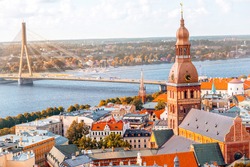 Cityscape aerial view on the old town with Dome cathedral and Daugava river in Riga city, Latvia