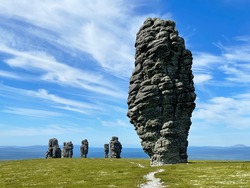 Stone pillars of weathering on the Manpupuner mountain plateau in the Komi Republic in Russia in summer in clear weather