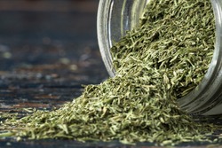 Dill Weed Spilled from a Spice Jar
