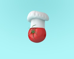 Chef hat with tomato concept on pastel blue background. minimal idea food and fruit concept. An idea creative to produce work within an advertising marketing communications or artwork design.