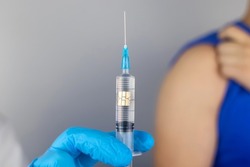 Concept. Chipping through vaccinations. Government conspiracy. Vaccination and implantation of a tracking microchip into the human body. Implantation of electronic technologies into the human body