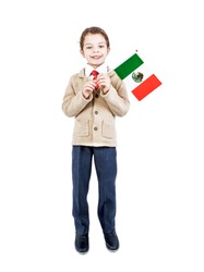 A little boy with flag of Mexico on the white background