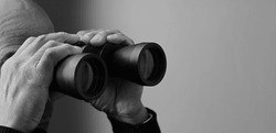 looking through binoculars look ahead for the future with people stock photo