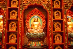Buddha statue sitting on lotusDecorated Inside the Buddha Tooth Relic temple ,Singapore near china town