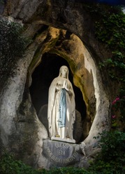 Statue of the Holy Virgin Mary in the grotto of Lourdes