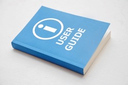 User guide book, Blue cover book on white background, instruction manual for user training 