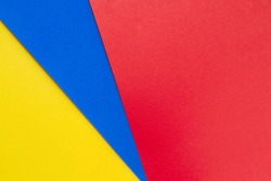 Yellow,blue and red papers background.Concept of primary colors