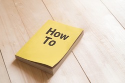 How to book or guidebook on wooden table