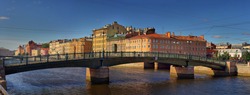 Large-format summer panorama of the Fontanka river embankment and Krasnoarmeysky bridge in St. Petersburg