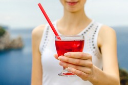  Woman Drinks Holds Cold Refreshing syrup Fresh Juice Drink sweet Straw Cherry Berries Fruit Summer Beach Island Sea Mood cocktai cranberry ice drink mountains background Diet Healthy detox vegeterian