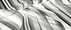 striped silk fabric Black and white. The surface of this fabric can be confused with chased silk - it is so textured and glossy! Consider making your project out of this material.