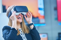Young woman wearing virtual reality device