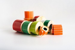 Multi-colored self-adhesive labels in label rolls for thermal transfer printer. Various forms for direct printing of your advertisement.