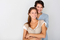 Cheerful young couple standing on white background, isolated