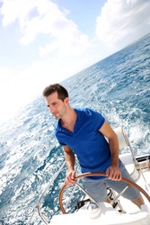 Young man sailing in caribbean sea