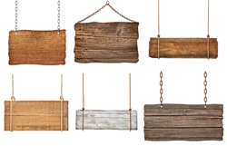 collection of various empty wooden signs hanging on a rope and chain on white background. each one is shot separately