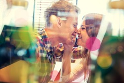 Double exposure with lovely romantic young couple enjoying and having fun in restaurant