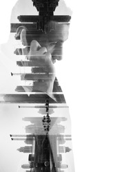 double exposure of business man with  mobile phone and city buildings background. abstract design idea