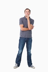Young man in thoughts against a white background