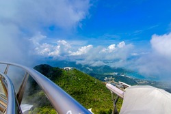 Panoramic view of fog,blue sky, sea, bridge and mountain seen from Langkawi Malaysia at Gunung Mat Cincang.This image may contain noise and blurry clouds due to long exposure