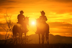   Silhouette Cowboy on horseback. Ranch