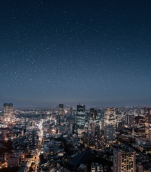 Epic cityscape of Tokyo at night with stars on the sky