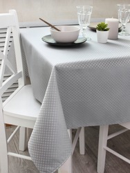 breakfast on the table with a gray tablecloth