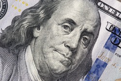 Texture of dollar bills. One hundred dollars. Close-up, macro.