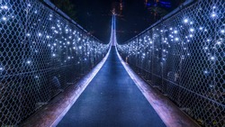 Vancouver, British Columbia - Canada. Long exposure at night, foggy view with Christmas lights of the Capilano Suspension Bridge. Vancouver. Beautiful British Columbia, Canada.