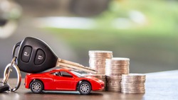 red car  and key on stacks of coin,  car loan concept,  Saving money for car concept,  trade car for cash concept, finance concept.