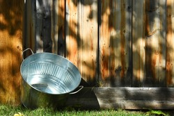An image of an old metal washtub used for doing laundry.