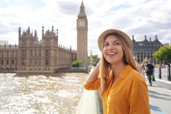 Smiling female tourist visiting London sights, United Kingdom