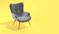 Comfortable fashionable gray designer armchair on yellow background. Trendy colors of the year 2021. Illuminating and Ultimate gray. Creative minimalistic layout with a single piece of furniture