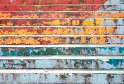 Colorful  and worn painted concrete stairs. 