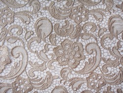 Gold lace fabric. Flowers. Lace.