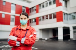 Paramedic in front of isolation hospital facility.Coronavirus Covid-19 heroes.Mental strength of medical professional.Emergency room doctor prepared for virus outbreak.Ready for hard work.Brave nurse