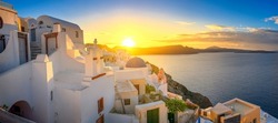 Picturesque sunrise on famous view resort over Oia town on Santorini island, Greece, Europe. famous travel landscape. Summer holidays. Travel concept background.
