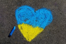 Heart shaped flag of ukraine, chalk drawing. Support and love for Ukraine