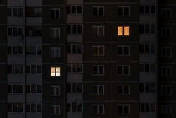 Flat night panorama of light in windows of multistory buildings. life in big city. concept for a couple in love on isolation
