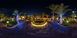 full seamless spherical night hdr 360 panorama on territory of elite hotel with palm trees and neon  lights in desert on shores of  Red Sea in equirectangular projection. VR concept