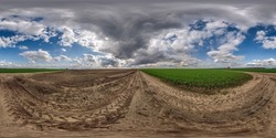 full seamless spherical 360 hdri panorama view on no traffic gravel road among fields in spring day with beautiful clouds in equirectangular projection, ready for VR AR