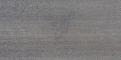 panorama of surface from above of gravel road with car tire tracks